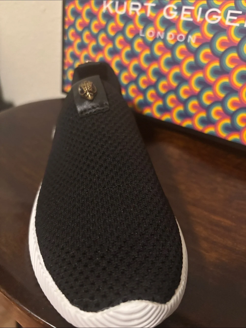 Kurt Geiger Black Knit Slip-On Sneakers with Gold Emblem